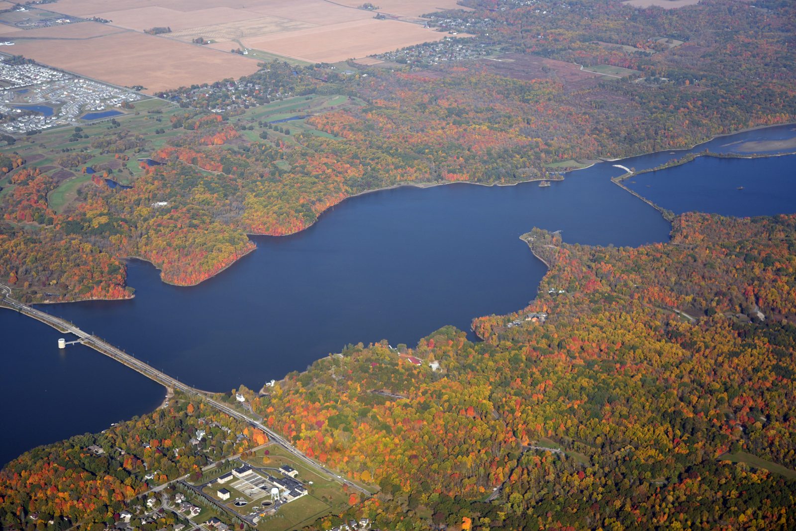 Aerial view of Eagle Creek Park and Reservoir in autumn, the open water and forest north of Camby, Indiana